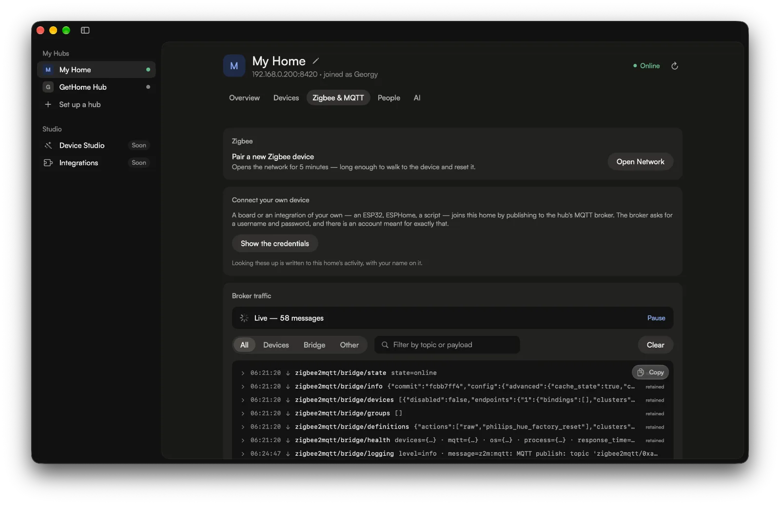 Studio 1.0.4 on the same tab: under the compact header, the pairing and credentials cards, then the broker’s live log with its filters and first messages.
